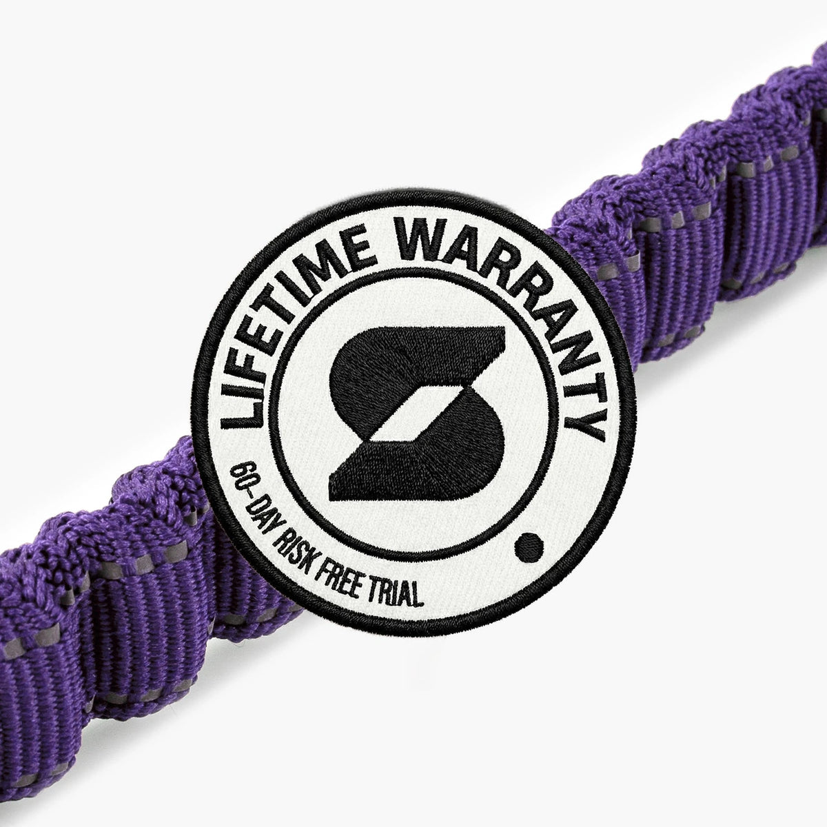 Lifetime Warranty, 60-day risk free trial badge over the Indigo bungee leash