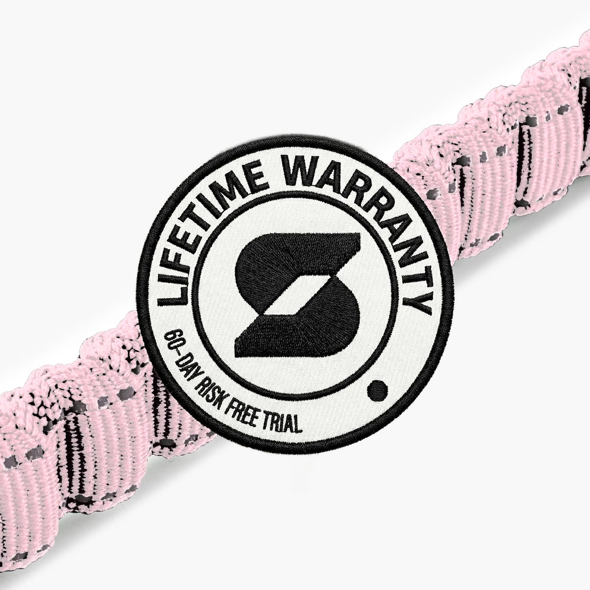 Lifetime Warranty, 60-day risk free trial badge over the Sakura bungee leash