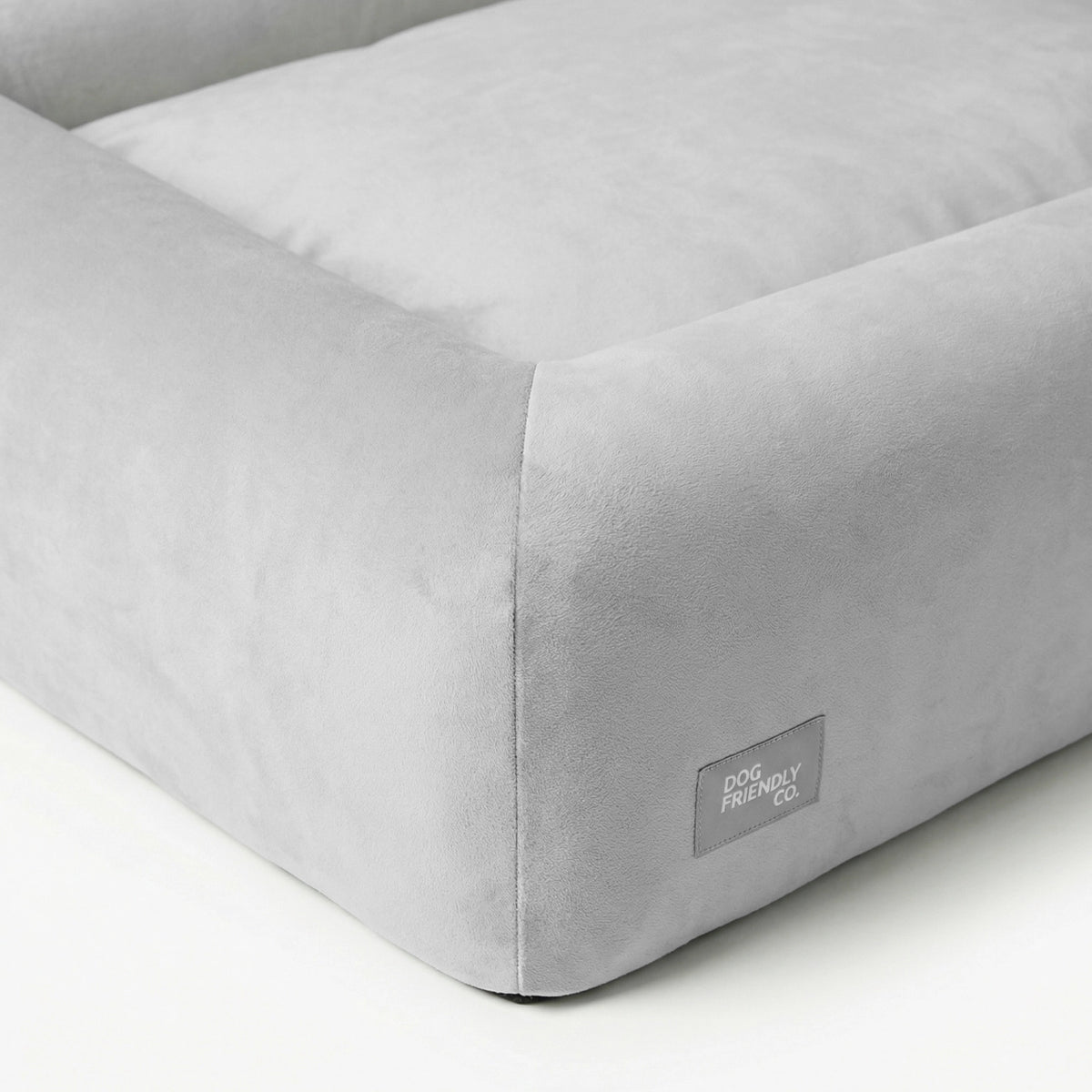 Grey orthopedic dog bed showing the breathable cover and supportive layered foam construction.