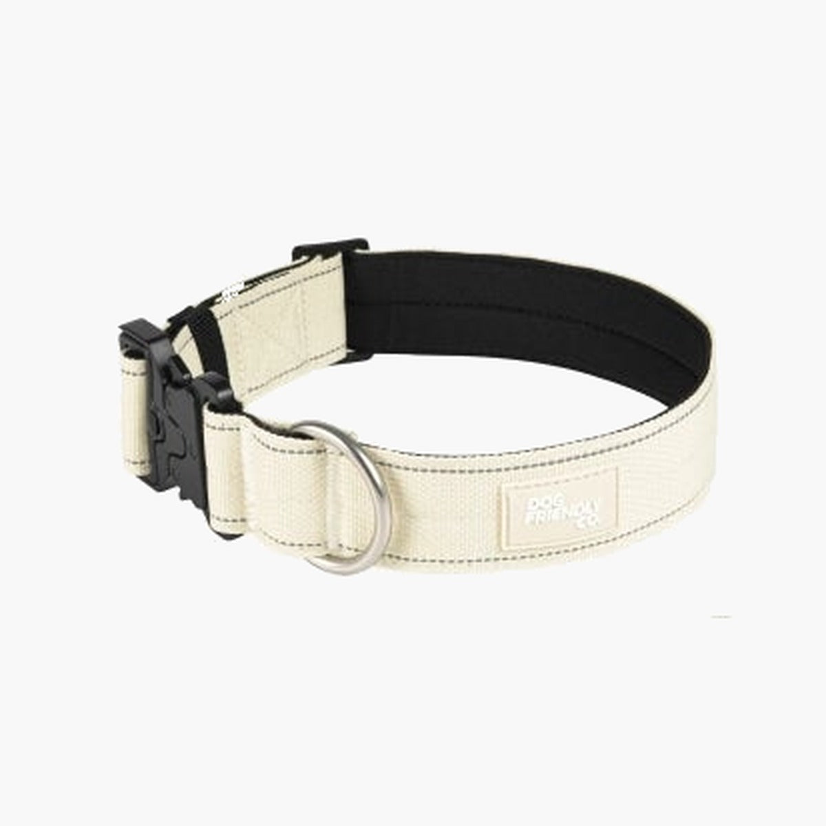 Latte (cream) tactical dog collar with a black quick-release buckle, black padded lining and silver D-ring